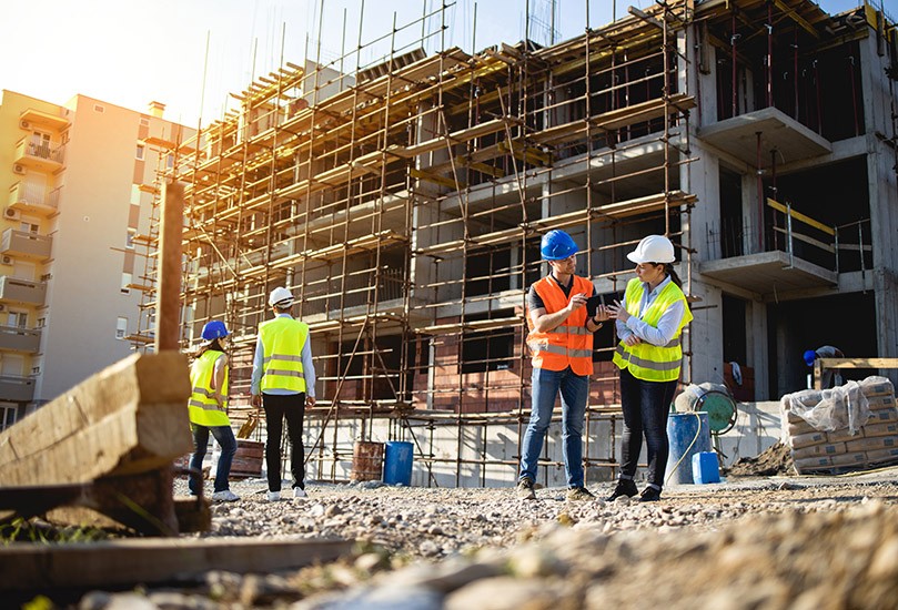Four construction workers having meeting,stock photo