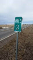 mile 3 road sign